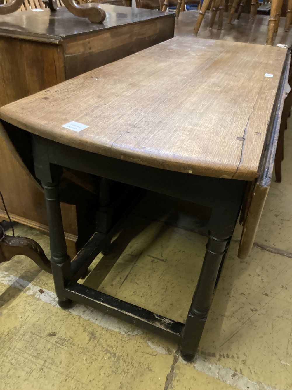 An 18th century oak gateleg dining table, width 128cm 150cm extended height 74cm